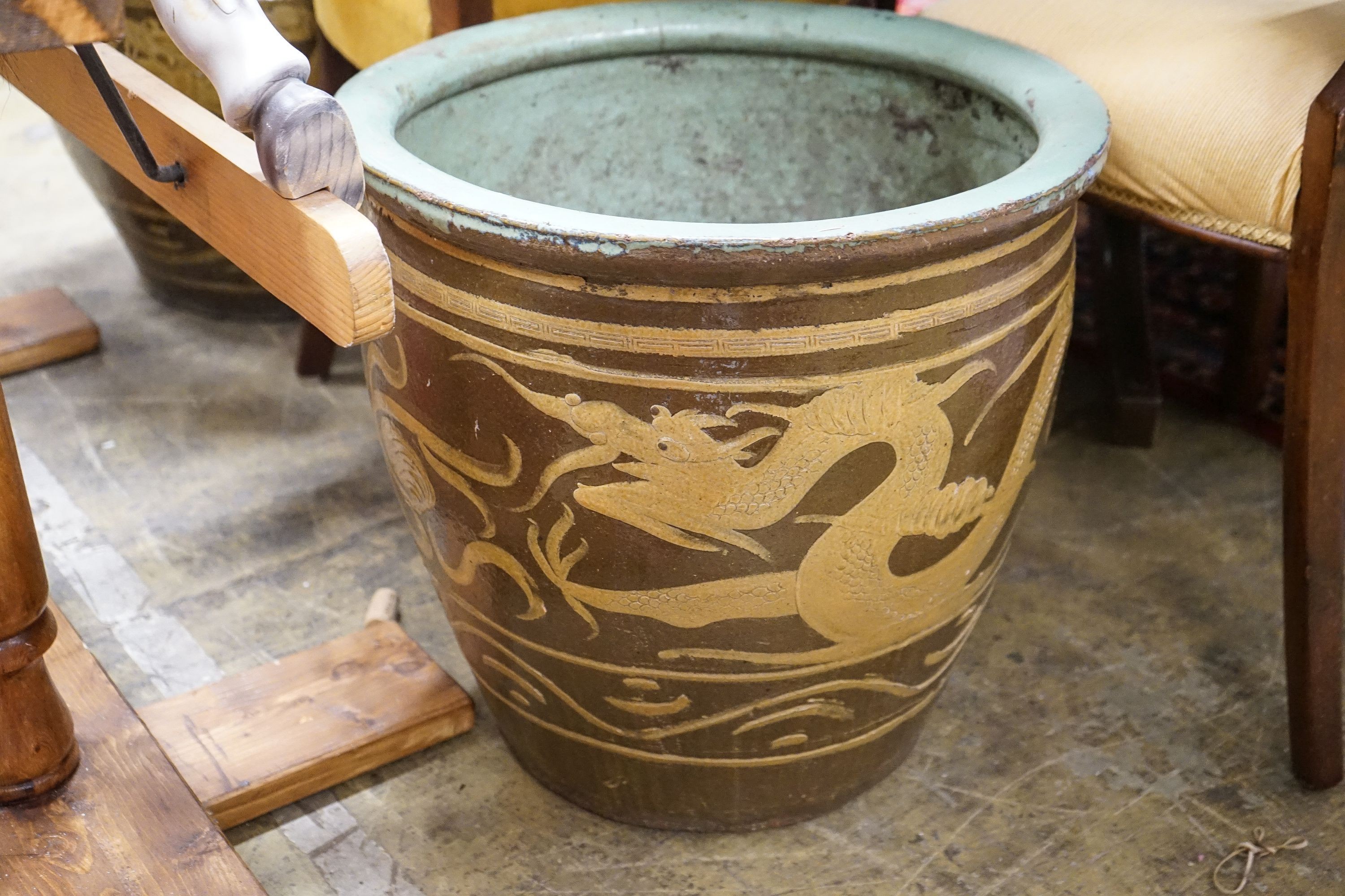 A pair of Chinese style circular glazed earthenware planters, diameter 50cm, height 47cm